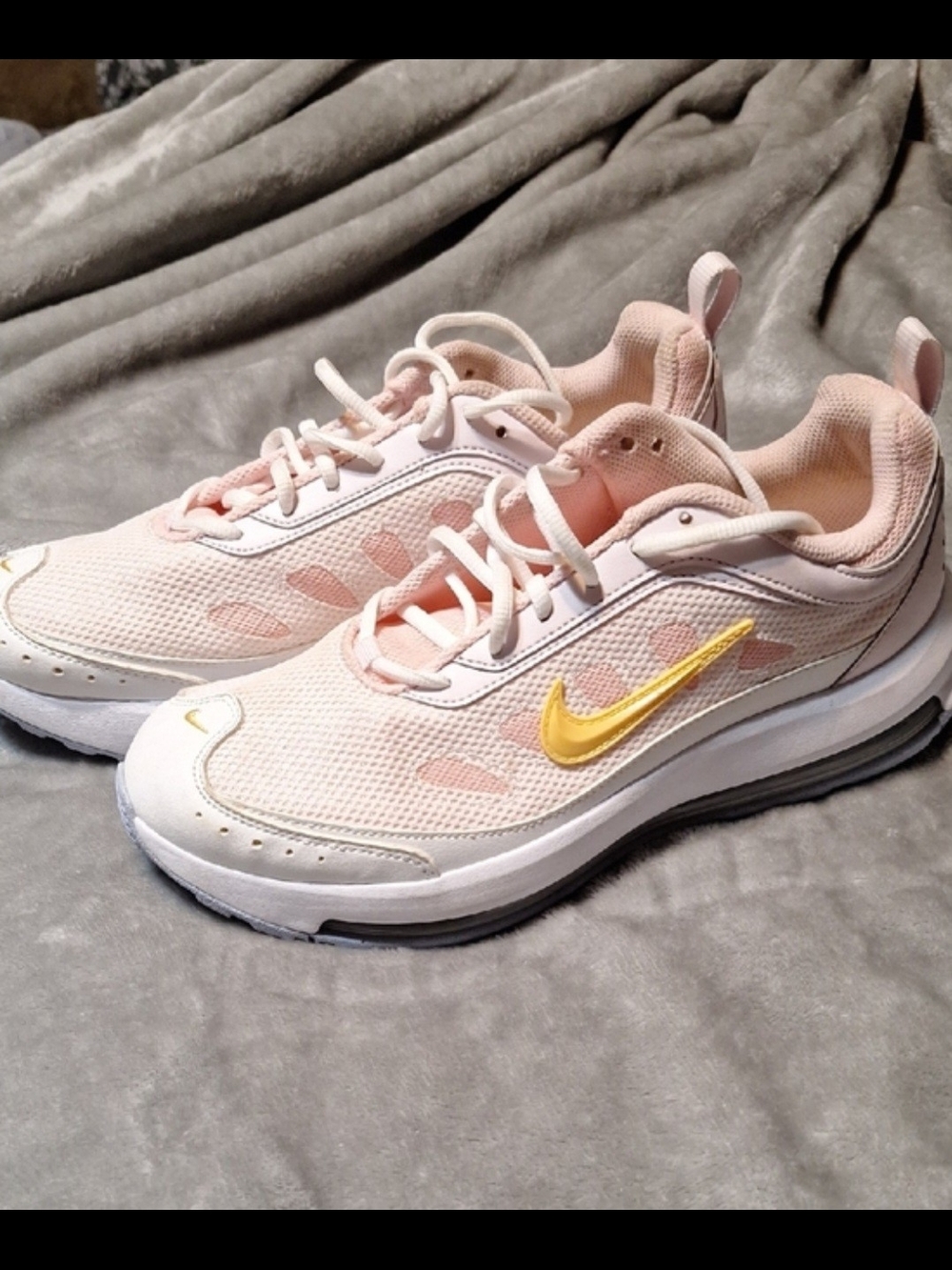 Nike Women's Pale Pink Mesh Athletic Sneakers with Yellow Swoosh